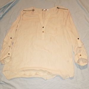 Light weight blouse with faux gold embellishments.